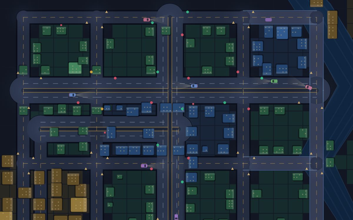 Top-down view of a simulated city at dusk: a grid of streets and avenues with lane markings and roundabouts, colored residential, commercial and industrial zones, buildings with lit windows, and cars queued at signals.